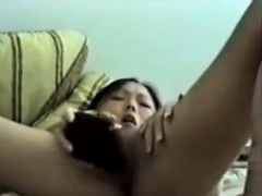 Horny Asian Masturbates With Hairbrush