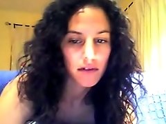 Busty curly haired sexy girl on webcam masturbates