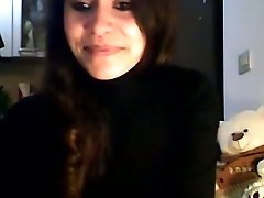 Sensational brunette teen on webcam takes off her black panties
