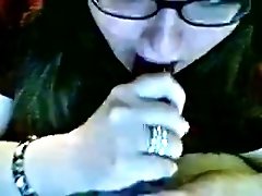 Nerdy amateur webcam slut licks a glossy plastic dildo