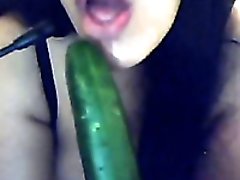 Busty Argentinian brunette babe plays with a cucumber on webcam