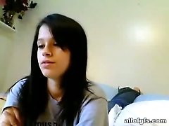 Buxom cute brunette gets rid of top to boast of her nice boobs on webcam