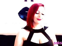 'strict classy lady with red hair smokes a cigarette on webcam'