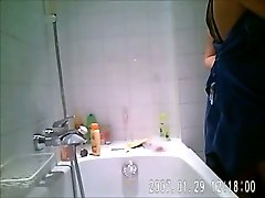 Chubby white wife with big tits in the bathtub on hidden cam video