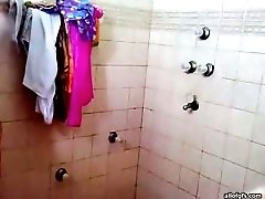 Slim Indian teen takes shower in front of camera