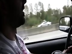 Hot Babe rubbing a cock while the guy driving caught on tape