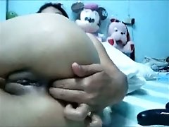 Nasty Asian chick with shaved pussy masturbates for me on webcam