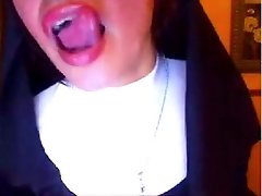 Buxom brunette webcam bitch in nun's uniform flashes her boobs