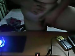 Webcam scene with mature Filippina fingering her cunt