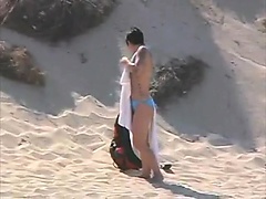 Voyeuring horny nudist girl fingering in public