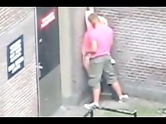 Pink shirt man fucked his chick in the ass right on the street