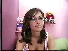 Nerdy brunette girl from webcam takes off her bra and flaunts her tits
