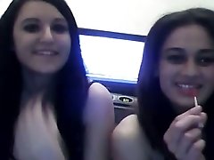 Two pretty young Caucasian lesbians finger fuck and eat pussies on webcam