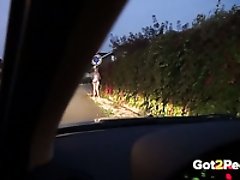Slender leggy auburn chick is caught pissing near the road sign