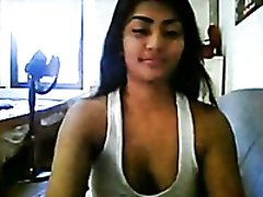 Beautiful dark skin hottie flashes her big boobs on webcam