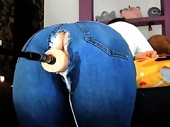 MILF in Ripped Jeans Fucks Machine Dick