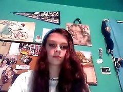 Redhead teen cutie with serious face masturbating on webcam