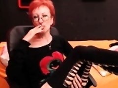 Hot redhead lady with glasses enjoys a cigarette and loses