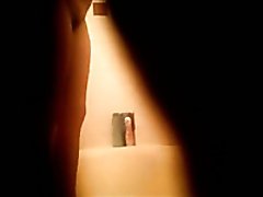Spy cam catches beautiful brunette gal masturbating in the bathroom