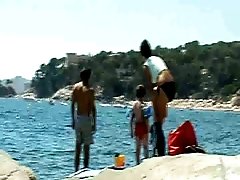 Group of naked chicks play Frisbee and on nude beach - spy cam
