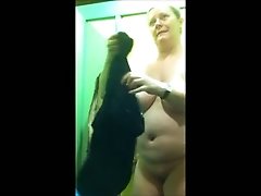 Chubby mature blondie changes her clothes in public locker room
