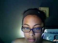 Ebony girl in glasses exposes her body for the webcam