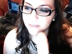 Nerdy Chick with glasses sucking dildo and masturbating