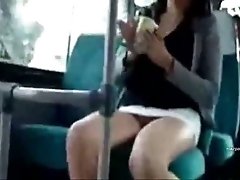 Naughty chick flashes her pretty pussy on the public transport
