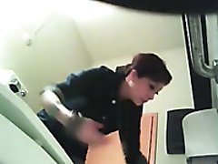 Hidden cam video of amateur brunette in the public WC
