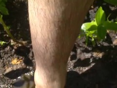 'Very Hairy Hirsute Camgirl Shows Hairy Girl Legs Outside in Garden Splashes Muddy Wet Dirty Puddle'