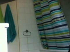 My showering stepsister unaware of spy camera