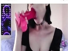 pink dildo is sucked by mouth with spit all over it