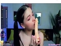 babe enjoys sucking dildo while spitting