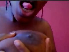 Thick and busty ebony webcam hoe sucks on her nipples and masturbates