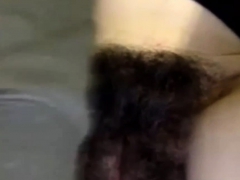 Close up of girl playing with massive hairy bush