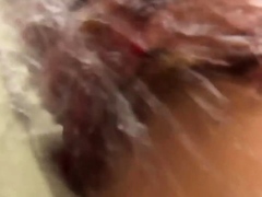 Asian babe splashes piss onto spycam