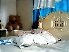 Shapely Filipina webcam lady plays with her tight pussy in bed