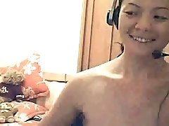 Beautiful and shy Asian girl shows me her tits on webcam