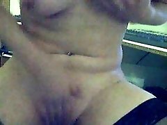 Dirty blond webcam slut shows her pierced tits and rubs her cunt