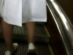 Following a hot blonde babe with long skirt and filming her naked butt and pussy