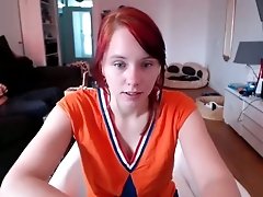 Red-haired nympho with shapely breasts loves masturbating on cam