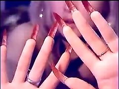 Auburn MILFie nympho with red nails took a dildo to have fun on webcam