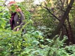 Redheaded Babe Pisses Long And Hard In Trees