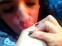Amateur brunette girl sucks her toes in front of a webcam